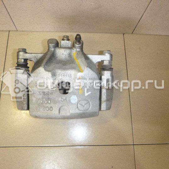 Фото Суппорт тормозной передний левый  B4Y73399ZB для Mazda Cx-3 Dk / 3