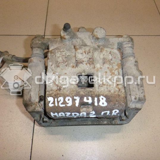 Фото Суппорт тормозной передний правый  DFZ13398Z для Mazda 2