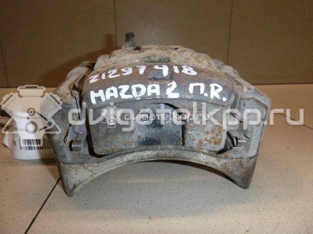 Фото Суппорт тормозной передний правый  DFZ13398Z для Mazda 2 {forloop.counter}}