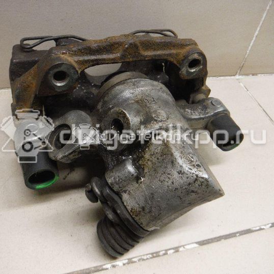 Фото Суппорт тормозной задний левый  1365653 для mazda Mazda 3 (BK)