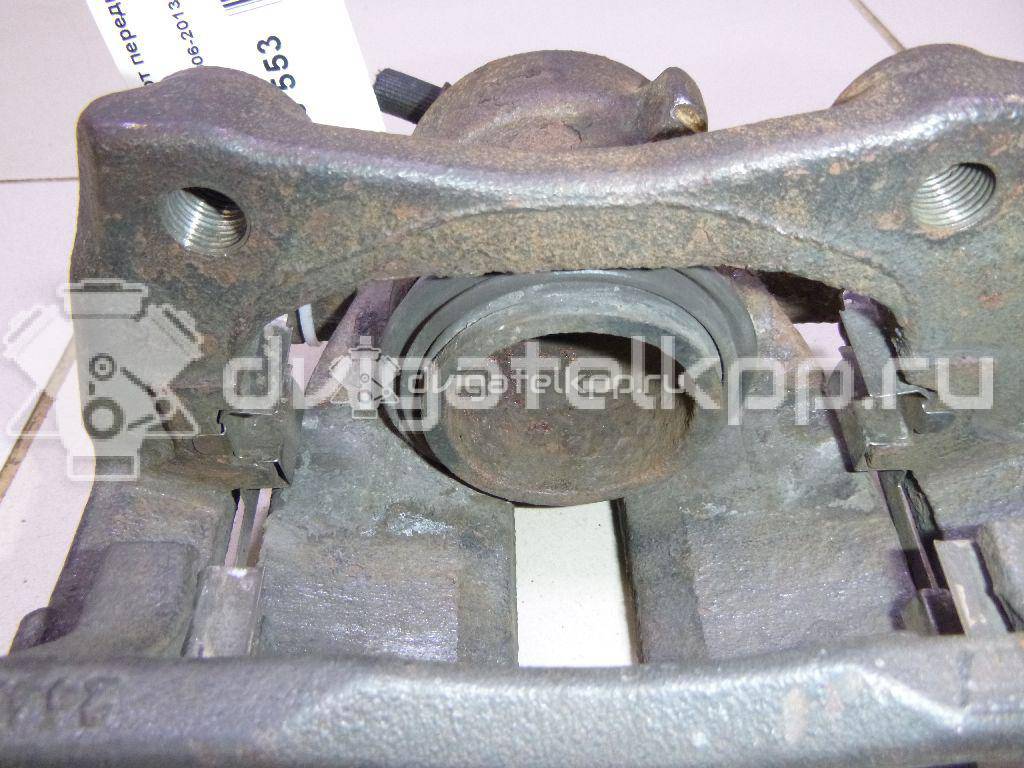 Фото Суппорт тормозной передний левый  41011AX60A для Nissan Note / Micra {forloop.counter}}