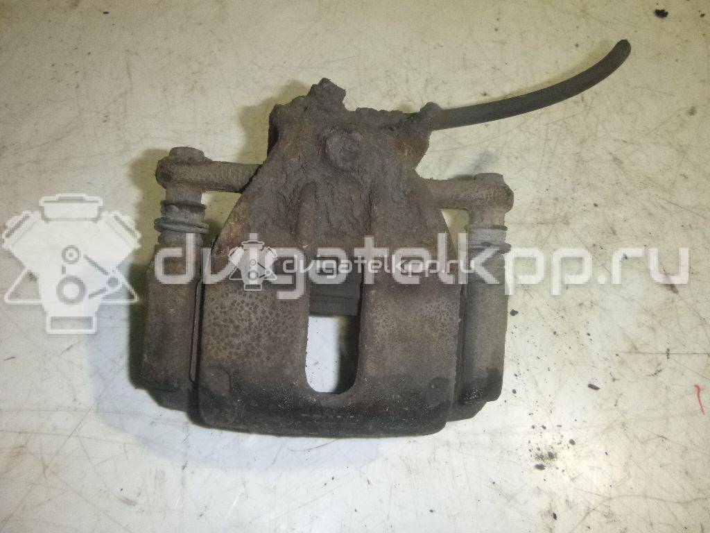 Фото Суппорт тормозной передний левый  41011AX60A для Nissan Note / Micra {forloop.counter}}