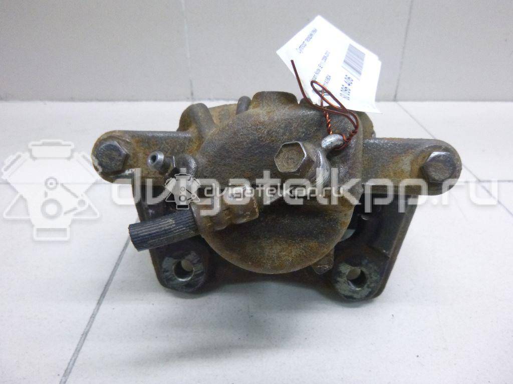 Фото Суппорт тормозной передний левый  41011AX60A для Nissan Note / Micra {forloop.counter}}