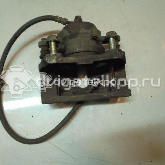 Фото Суппорт тормозной передний левый  410111HA0A для Nissan Note / Micra