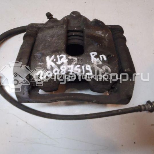Фото Суппорт тормозной передний правый  410011HA0A для Nissan Note / Micra