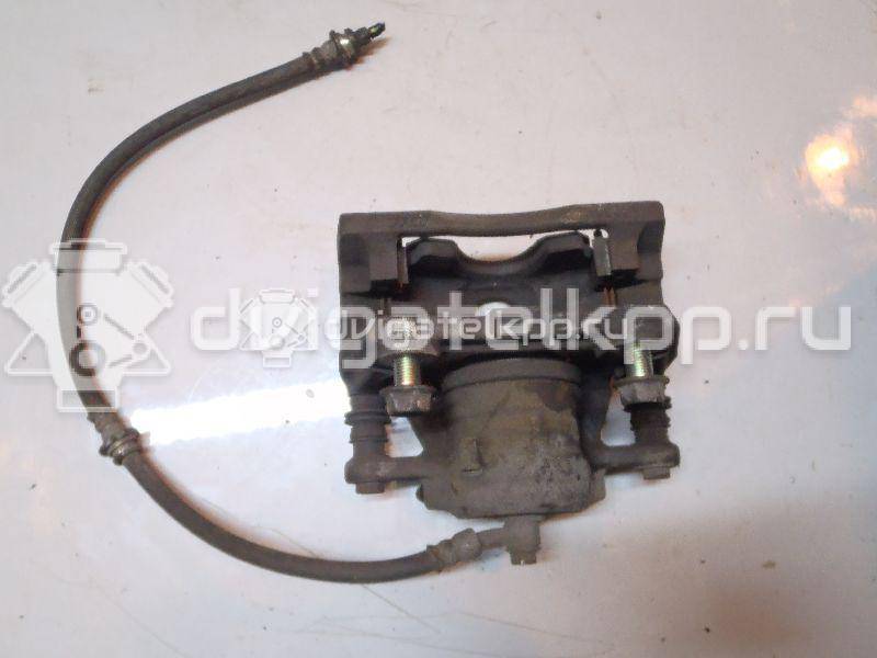 Фото Суппорт тормозной передний правый  410011HA0A для Nissan Note / Micra {forloop.counter}}