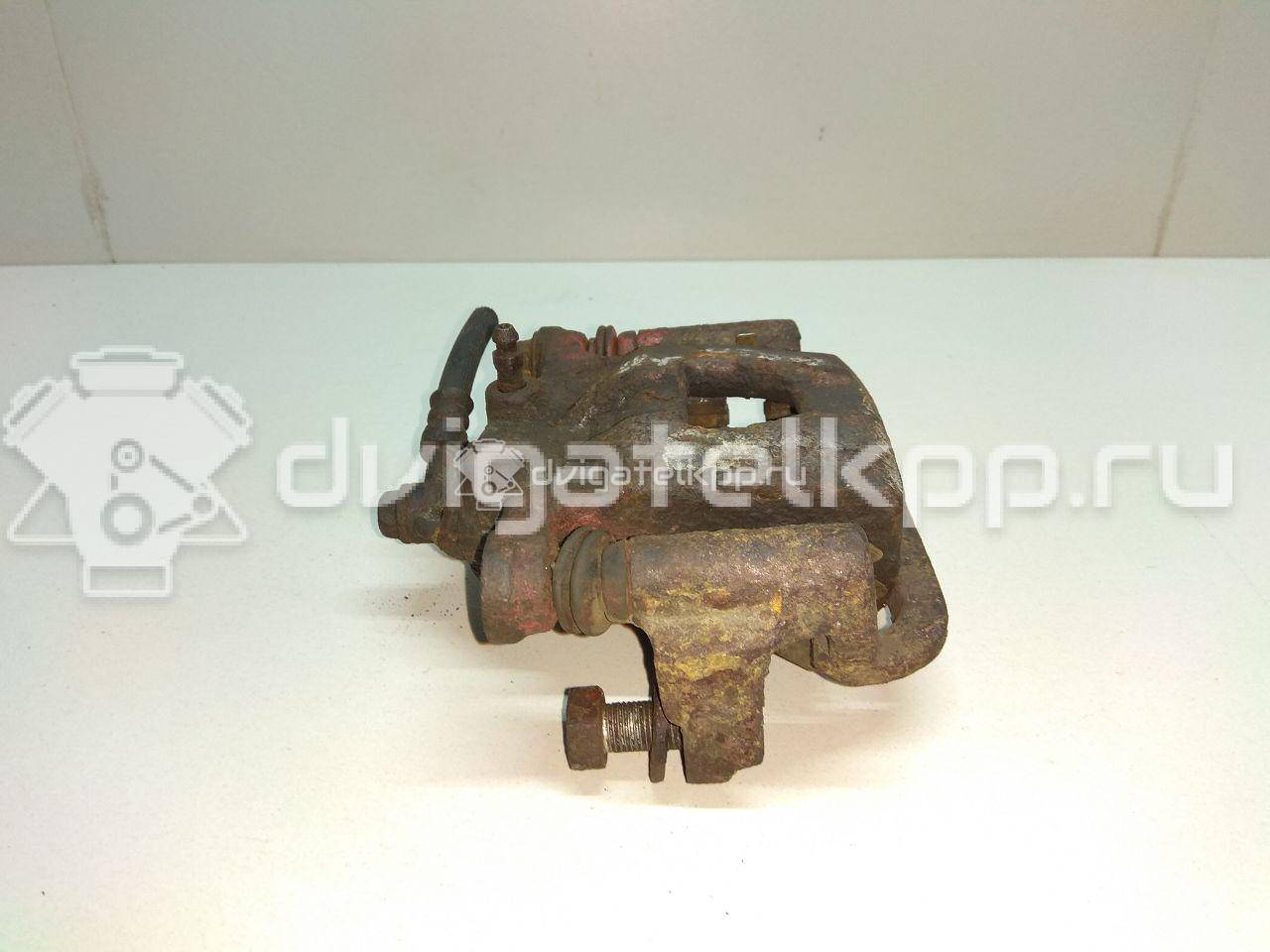 Фото Суппорт тормозной задний правый  44001EM11A для Nissan Tiida / Qashqai / Cube Z12 / Juke F15 / Pulsar C13 {forloop.counter}}