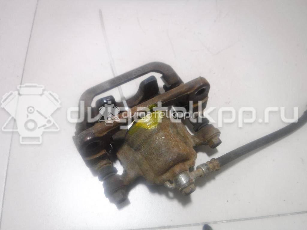 Фото Суппорт тормозной задний правый  44001EM11A для Nissan Tiida / Qashqai / Cube Z12 / Juke F15 / Pulsar C13 {forloop.counter}}