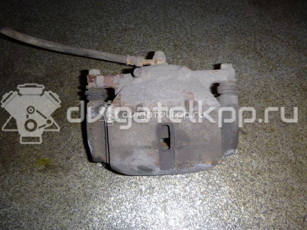 Фото Суппорт тормозной передний правый  41001JD00A для Nissan Qashqai / X-Trail {forloop.counter}}