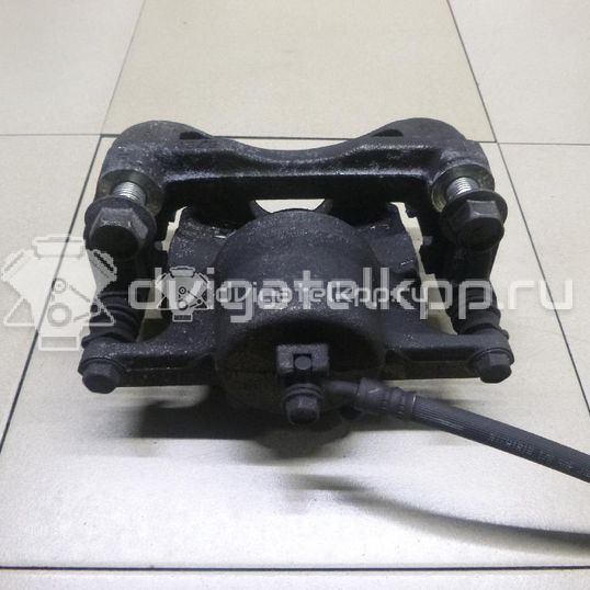 Фото Суппорт тормозной передний левый  410114EA0A для Nissan Qashqai