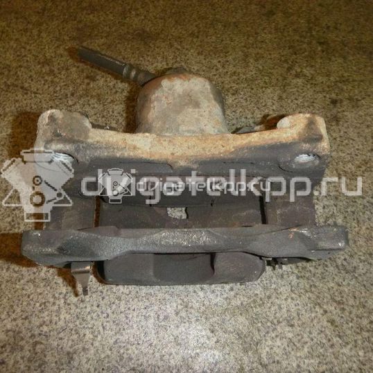 Фото Суппорт тормозной передний левый  410111KC2C для Nissan Tiida / 200 Sx / Primera / Cefiro / Prairie