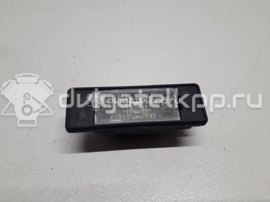 Фото Фонарь подсветки номера  26510AU300 для Nissan Primera / Micra / Note / Nv200 / Np300 {forloop.counter}}