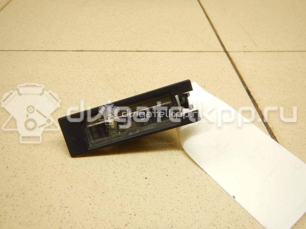 Фото Фонарь подсветки номера  9164143 для Opel Astra / Tigra / Corsa {forloop.counter}}