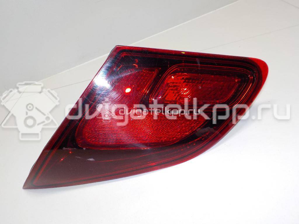 Фото Фонарь задний внутренний правый  13306456 для Opel Astra {forloop.counter}}