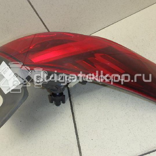 Фото Фонарь задний наружный левый  1222209 для Opel Astra