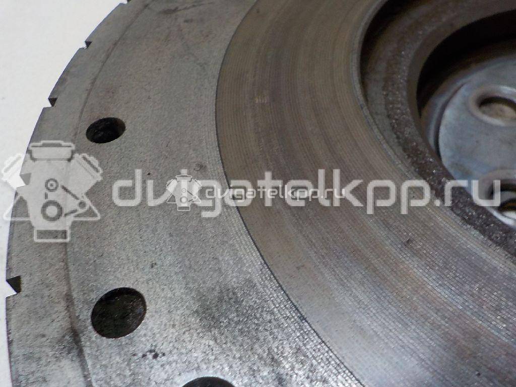 Фото Маховик для двигателя CR14DE для Nissan Note / Micra 88-98 л.с 16V 1.4 л бензин 12310AX100 {forloop.counter}}