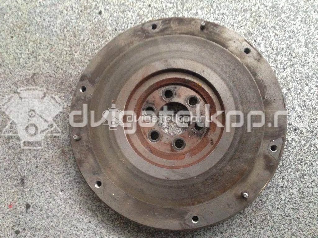 Фото Маховик для двигателя QG18DE для Nissan Primera / Almera 106-128 л.с 16V 1.8 л бензин 123119F600 {forloop.counter}}